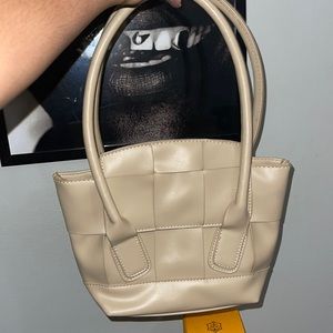 Tan long shoulder strap bag, with Bottega Venetta inspired detailing
